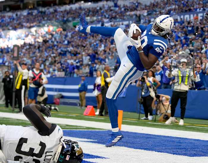 Oct 16, 2022; Indianapolis, Indiana, USA; Indianapolis Colts tight end Jelani Woods (80) comes down in the end zone with the ball for a touchdown against the Jacksonville Jaguars during the second half at Lucas Oil Stadium. Mandatory Credit: Robert Scheer-USA TODAY Sports